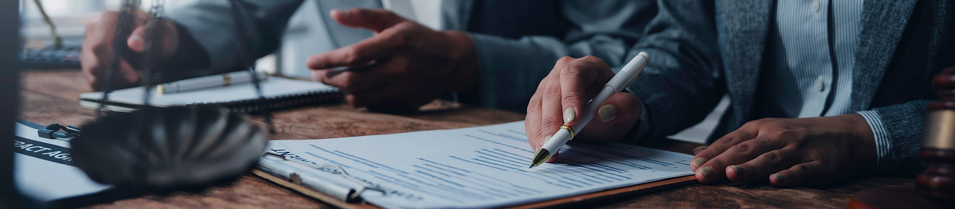 Two people discussing legal documents