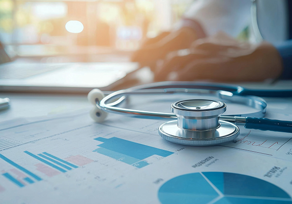 Medical Business Report under a stethoscope